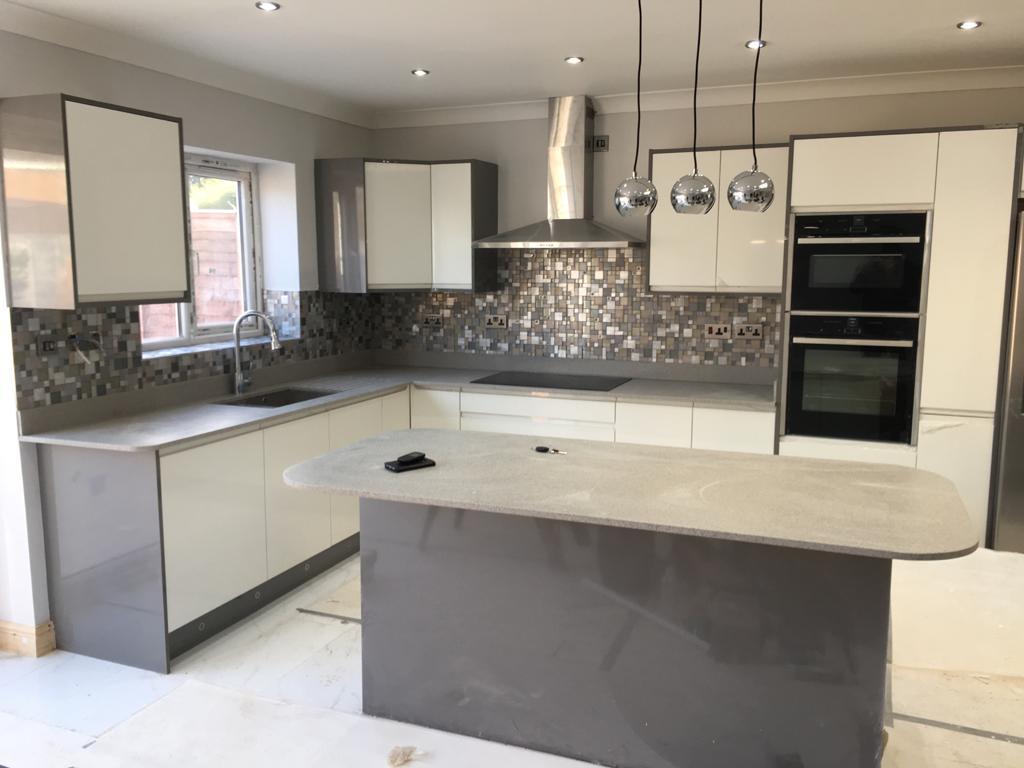 Light contemporary kitchen with mosaic splashback